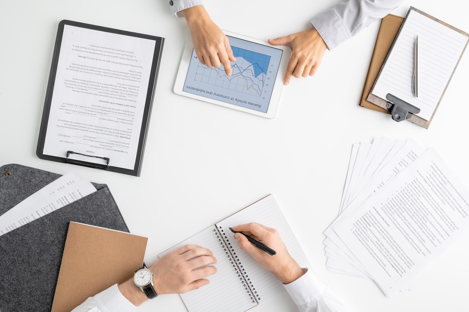 Flat layout of hands of two young managers or brokers analyzing online graphs Senior Contract Administrator – Cincinnati, OH (On-site)